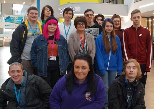 East Durham College creative industries students meet with Hartlepool Hospice, community fundraiser, Janice Forbes, centre standing.