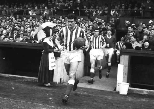 Charlie Hurley leads out the Sunderland team at Roker Park.