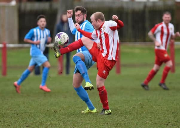 Ryhope CW (red/white) battle against Crook Town. Picture by Kevin Brady