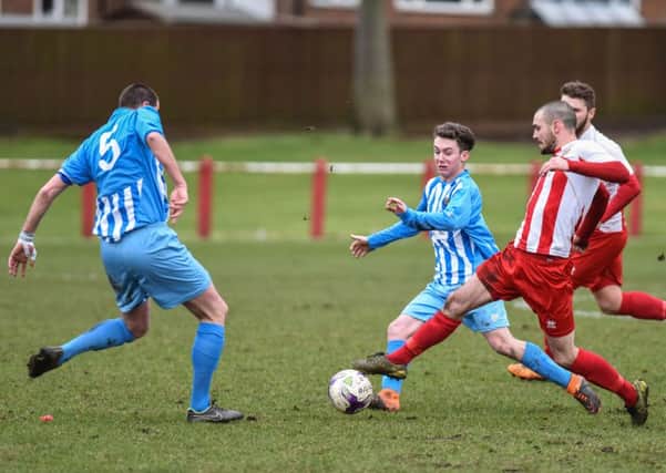 Ryhope CW's Josh Home-Jackson (right) takes on Crook Town in last week's 5-1 victory. Picture by Kevin Brady