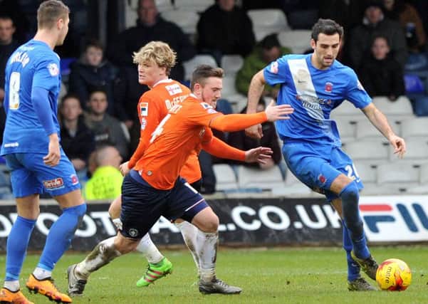 Adam Jackson (right) battles for Pools in last week's loss at Luton. Picture by Frank Reid