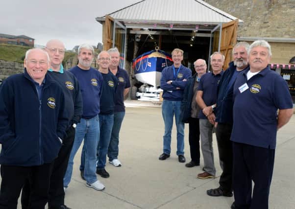 Members of East Durham Heritage Group, with the George Elmy lifeboat in the background.