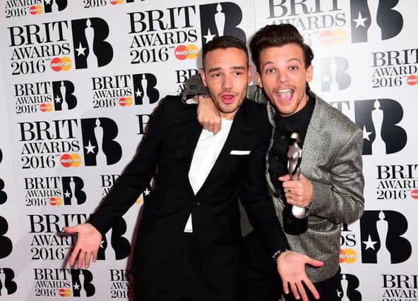 Liam Payne (left) and Louis Tomlinson (right)  picked up the BRIT Award for British Artist Video of the Year in the press room at the 2016 Brit Awards at the O2 Arena, London. PRESS ASSOCIATION Photo.