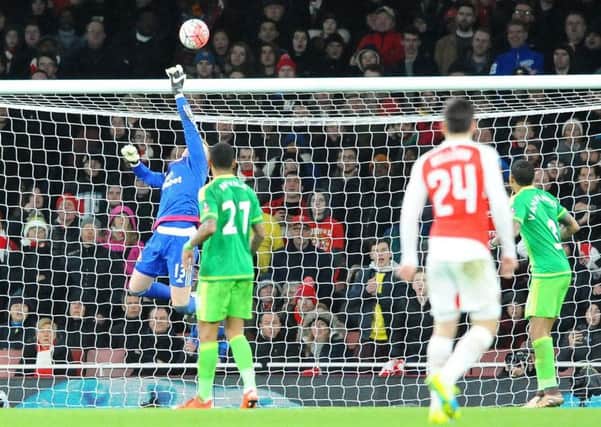 Jordan Pickford makes a save in the FA Cup defeat to Arsenal