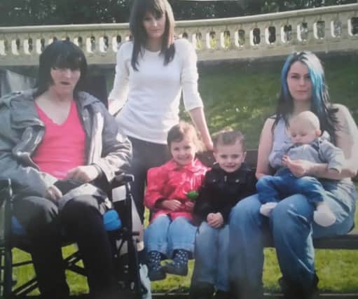 Maria pictured with daughter Stacey, grandchildren Nia, Bailey and Theo, and Nikki, far right