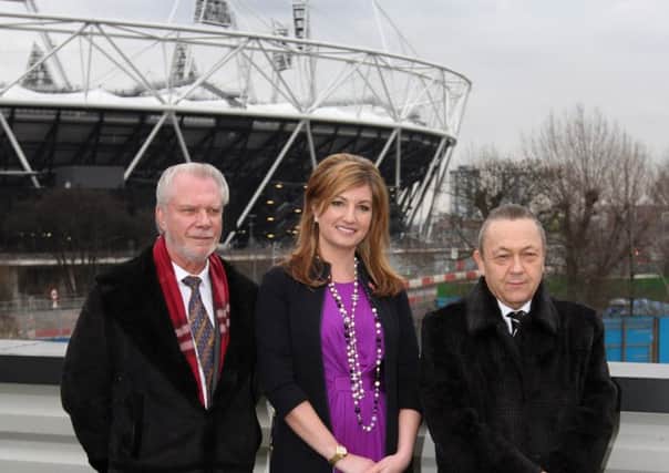 West Ham owners David Gold (left) and David Sullivan (right) with vice-chairman Karren Brady in front of the Olympic Stadium.