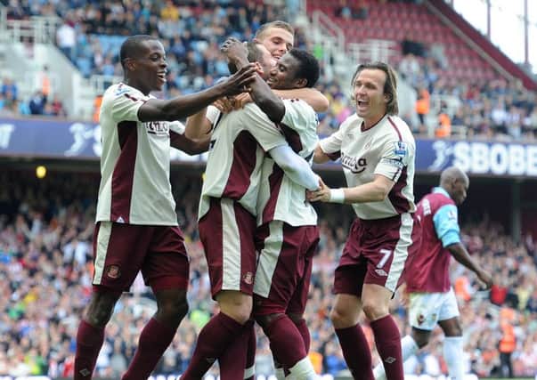 Stephane Sessegnon gets mobbed after scoring the second goal in Sunderland's 3-0 win at West Ham in 2011