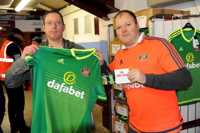 Andy O'Neill, 49, collects his away shirt