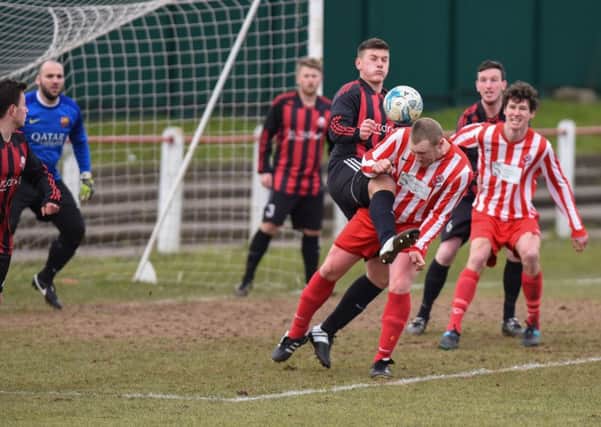 Seaham Red Star Reserves (red/white) battle against Ashbrooke Belford House. Picture by Kevin Brady