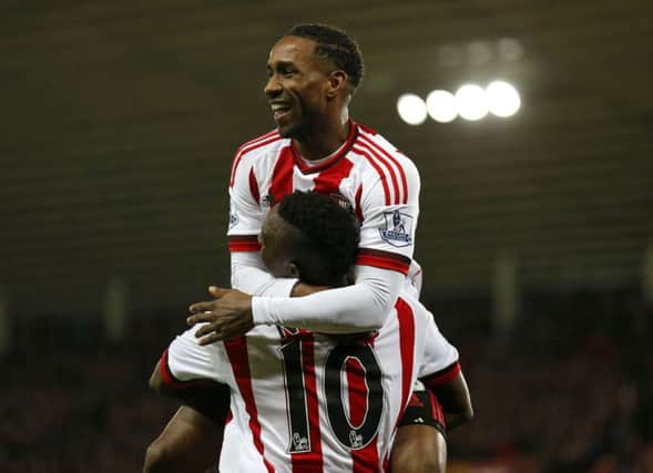 Sunderland's Dame N'Doye celebrates with team-mate Jermain Defoe