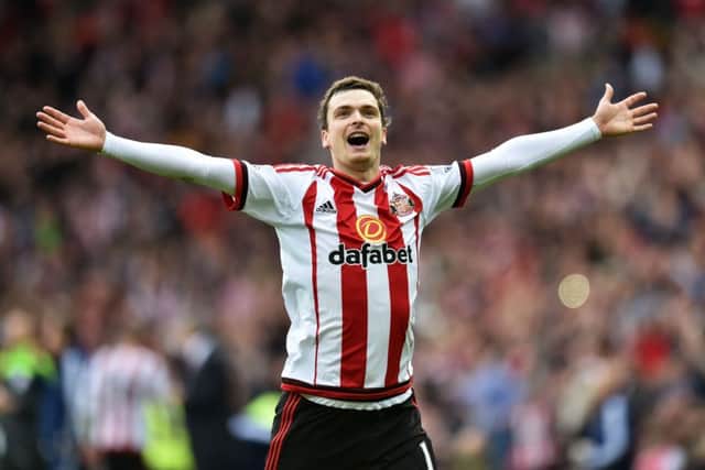 Former Sunderland winger Adam Johnson celebrates scoring their first goal of the game from the penalty spot during the Barclays Premier League match at the Stadium of Light, Sunderland. PRESS ASSOCIATION Photo