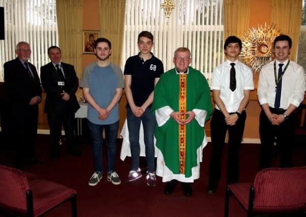 Seen after the presentation are, from left to right, are Brother Tony McCourt Sunderland Circle Schools Liaison Officer, Mr. Gerry Watson, the visit coordinator, Matthew Morrell, Thomas Buckley, Father Martin Wheaton, Aidan Fletcher and Aidan Watson School Chaplain.