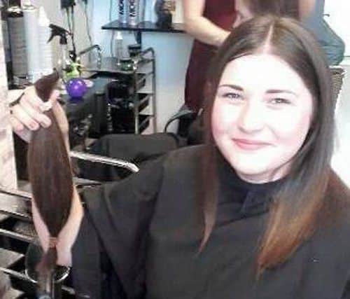 Alice Morton with the hair she has had cut for the Little Princess Trust.