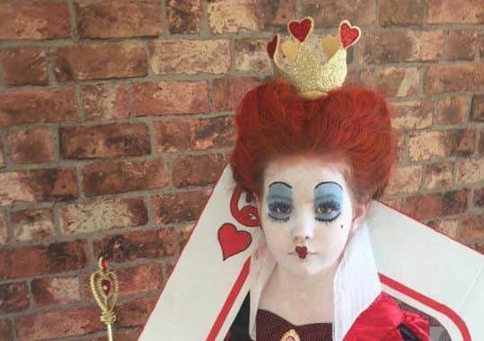 Millie Robinson, seven, as Queen of Hearts