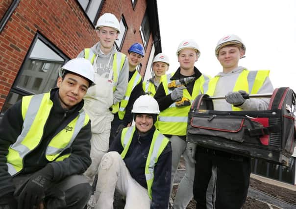 Andrew McPherson, left, with fellow apprentices at the Willow Bank site.