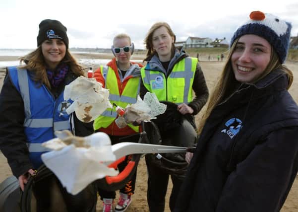 Volunteers, left to right, Rachael Forster, Victoria Humble, Louise Hopkins and Abi Forster, take part in the beach clean at Whitburn Beach.