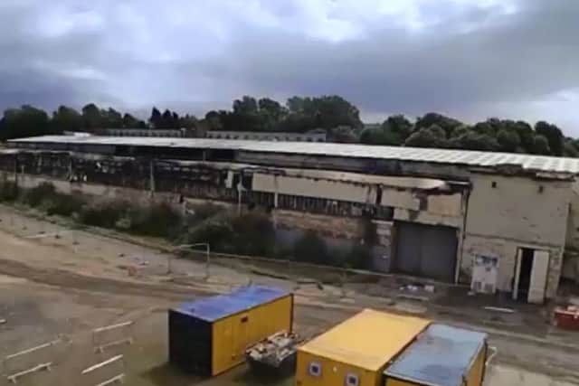 The time-lapse video shows the demolition of disused warehouses.
