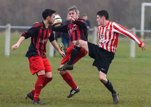 Sunderland West End (red/white) take on Ashbrooke Belford House at Ford Quarry on Saturday. Picture by Kevin Brady