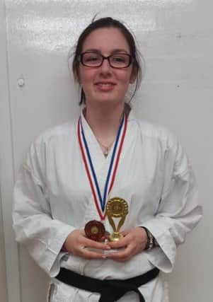 Georgia Maughan, from South Shields Community School Karate Club, with her trophy from her success at the recent NKA  competition.