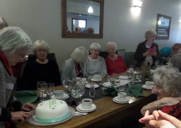 Sunderland Floral Art Clubs Chairman Pat Worthy cuts the cake as the club celebrates its emerald anniversary at Sunderland Catering College.