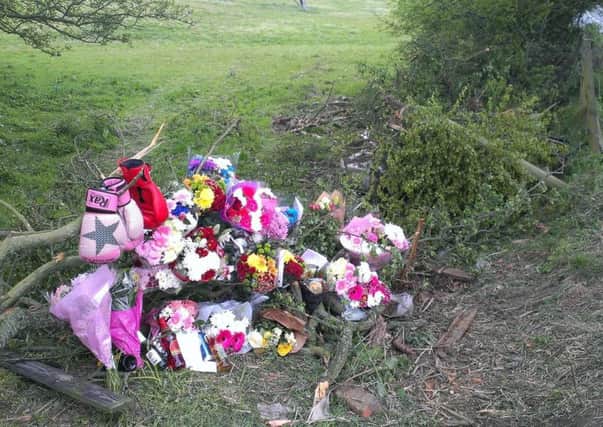 Flowers left at the scene of the crash in tribute to Karl Bennett.