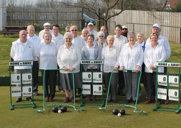 Members of the Dawdon bowls club with some of the new equipment.
