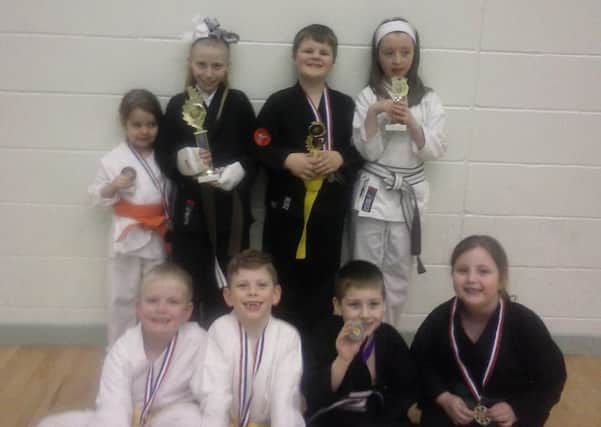 Farringdon Inspires Academy Primary School Karate Club students with some of the trophies they collected at a recent Northern Karate Association competition.