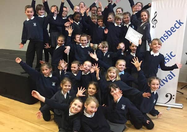 Hetton Lyons Primary School Choir celebrate coming first and second in a recent signing competition.