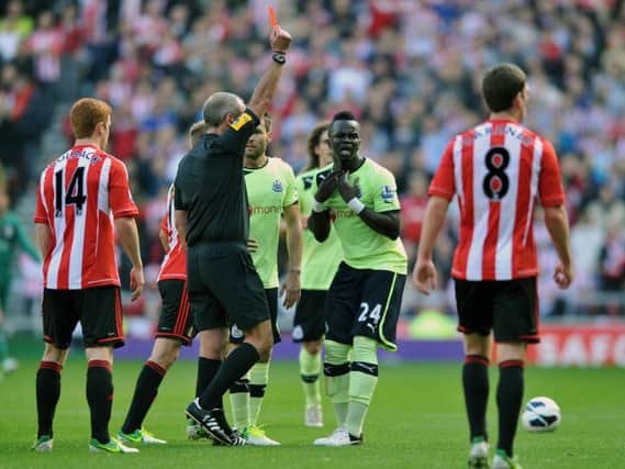 Newcastle United's Cheick Tiote is sent off by referee Martin Atkinson