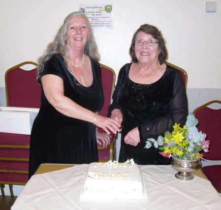 South Hylton WI president Christine Wilson and secretary Judith Thompson cut the cake marking the institute's 95th birthday.