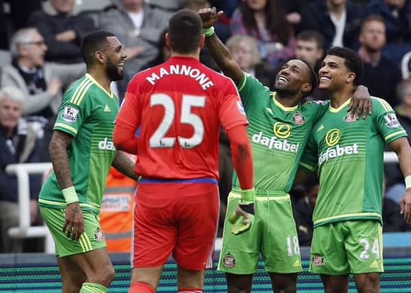 Jermain Defoe celebrates with his team mates after firing Sunderland ahead at St Jamess Park.