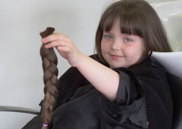 Little Isobelle Green, 7, had her haircut for Little Princess Trust.