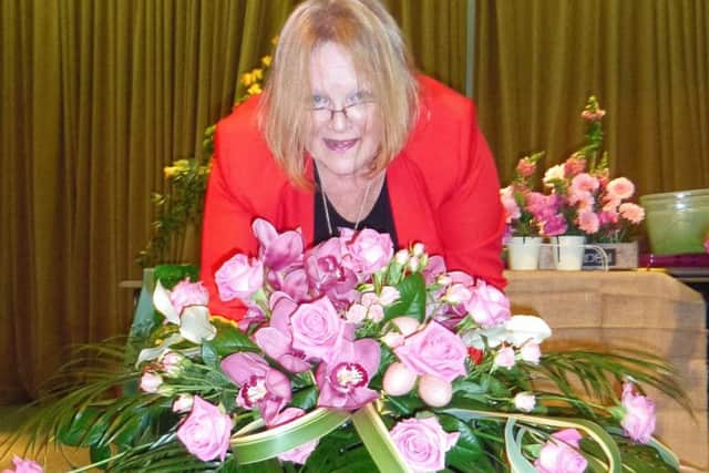 Pam with one of her arrangements.