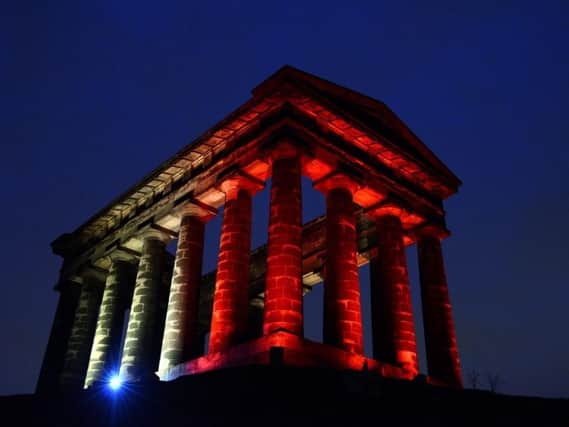 Penshaw Monument is lit up in the colours of Belgium's flag this evening.