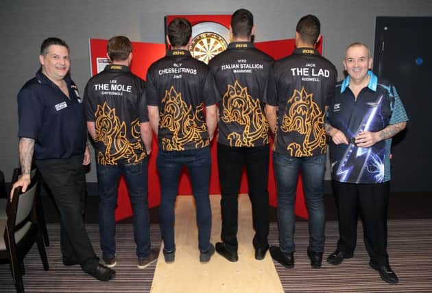 Gary Anderson, left, and Phil Taylor, right, took on four Sunderland AFC stars in a special night of darts.