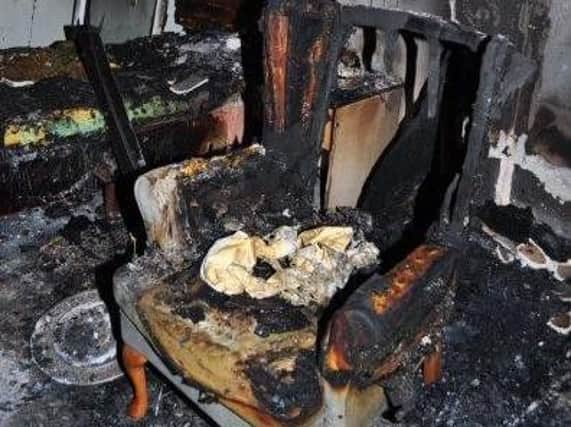A burnt-out chair in a resident's room at Donwell House Care Home. Pic: TWFRS.