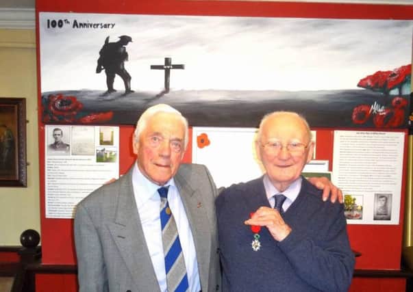 Washington Club Rotarian and fellow war veteran Alan Armitage, 91, with Tom Davison.