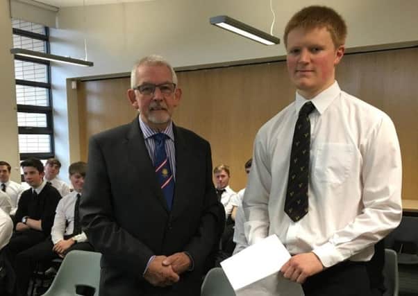 Dominic Walker with Bro Tony McCourt, Sunderland Circle Schools Liaison Officer, with other 6th Form studends in the background.
