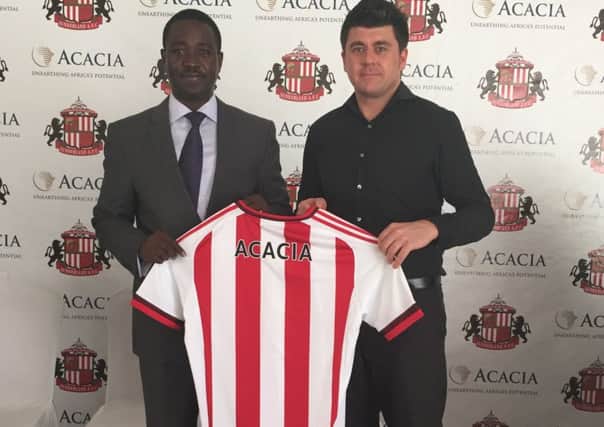 Deodatus Mwanyika, vice president of corporate affairs at Acacia Mining with Gary Hutchinson, commercial director at Sunderland AFC.