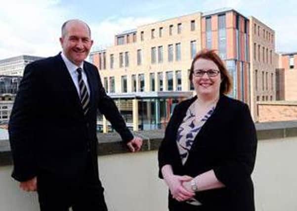 Neil McMillan, development director, Carillion and Janine Bonnick, North East area operations manager for HM Passport Office in front of the HM Passport Office in Durham.