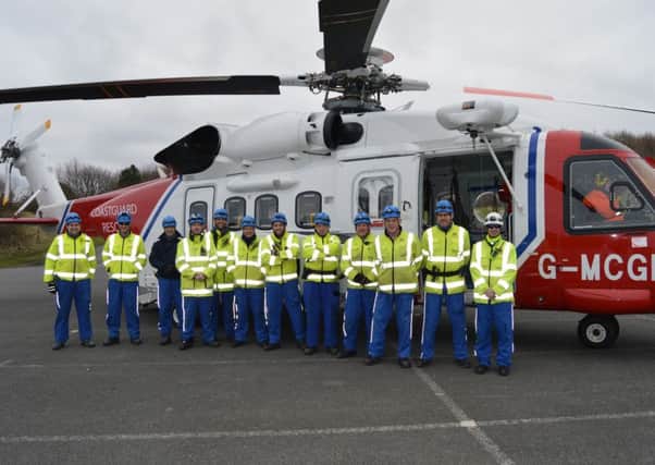 Coastguard Rescue Officers at Whitburn Coastal Park during a recent familiarisation exercise with one of HM Coastguards new helicopters.