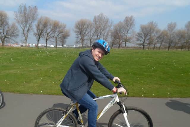 Kyle Abdullahi, 25, on one of the bikes.