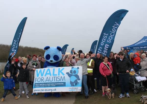 People on the walk to raise awareness of autism.