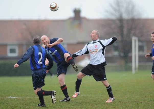 Mill View SC (blue shirts) battle in vain against Seaham Marlborough in last week's Ironside Cup semi-final at Thompson Park