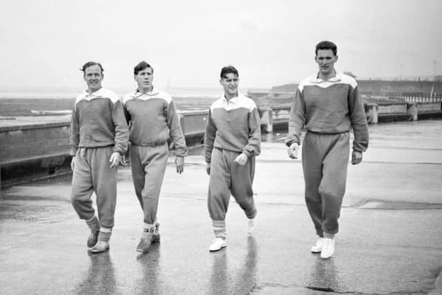 Sunderland players going for a walk along the promenade including Len Shackleton (second from left) and Billy Elliott (second from right).