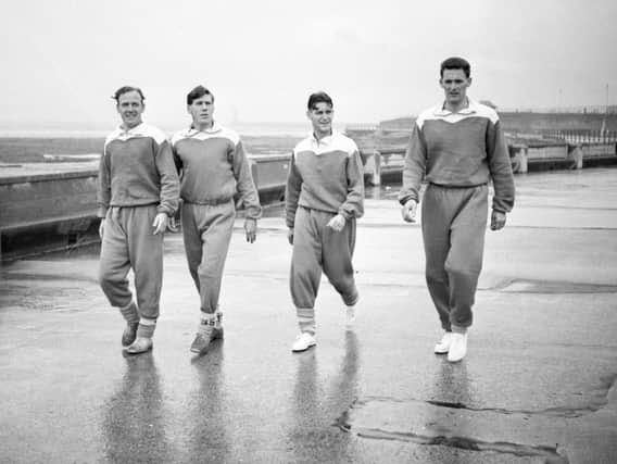 Sunderland players going for a walk along the promenade including Len Shackleton (second from left) and Billy Elliott (second from right).