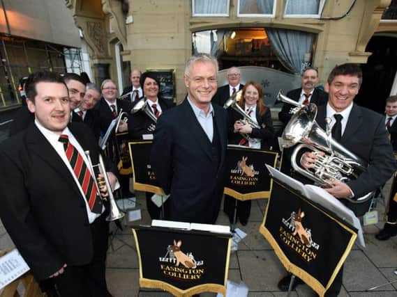 Director of Billy Elliot - The Musical, Stephen Daldry with Easington Colliery Brass Band playing outside of the Sunderland Empire.
Pic: North News and Pictures.