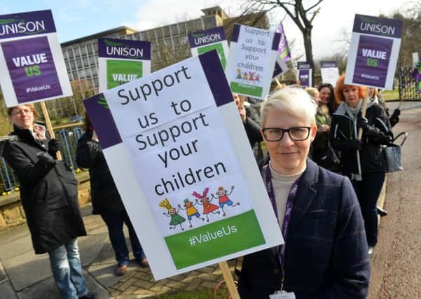 Unison organiser Helen Metcalf with teaching assistants outside Durham County Hall.