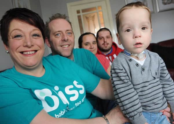 Michelle and Darrell Talbott with grandson Thomas, and his parents Lucy Darrant and Christopher Drayton, who are set to climb the Altlas Mountains to raise money for Bliss.