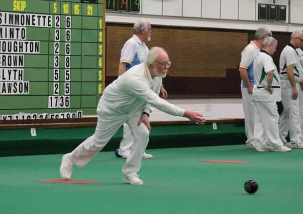 Peter Harding bowls for Houghton in their fine, promotion-winning victory at The Parks